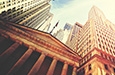 perspective photo looking up at bank facade in Greek architectural style