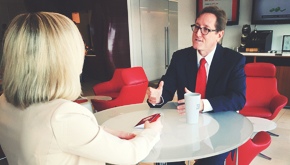 photo of two people sitting across table